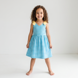 Kariertes Kleid mit gelben Schleifen für Mädchen